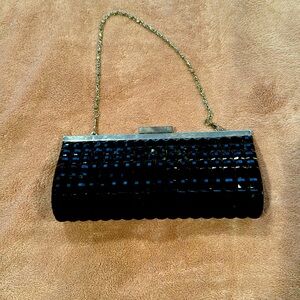 Black studded clutch